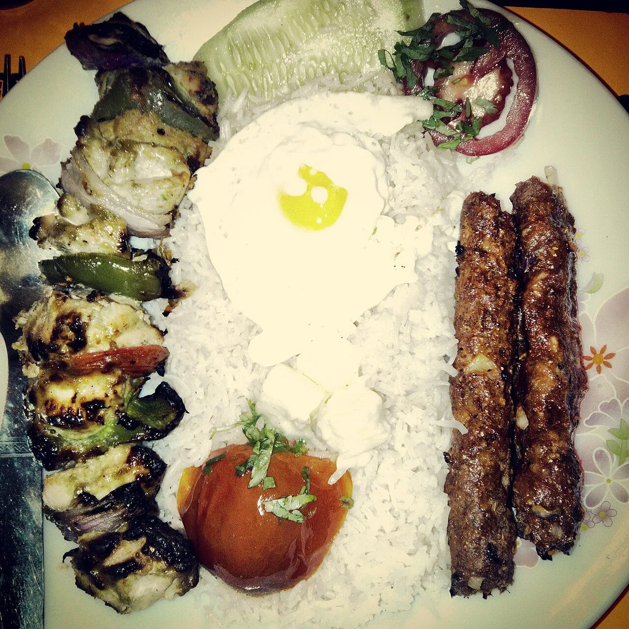 Chelo kabāb — saffron rice and koobideh, the de facto national dish.