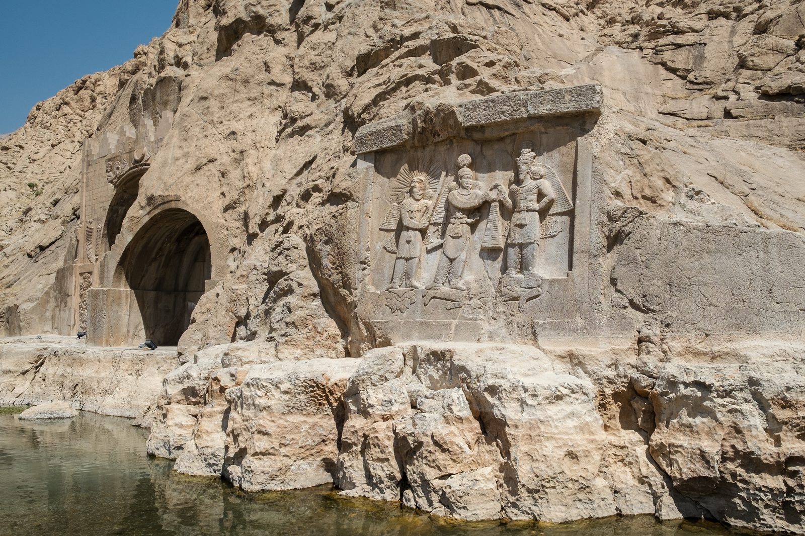 The Sasanian rock reliefs of Taq-e Bostan, set inside a cliff-cut iwan in Kermanshah.