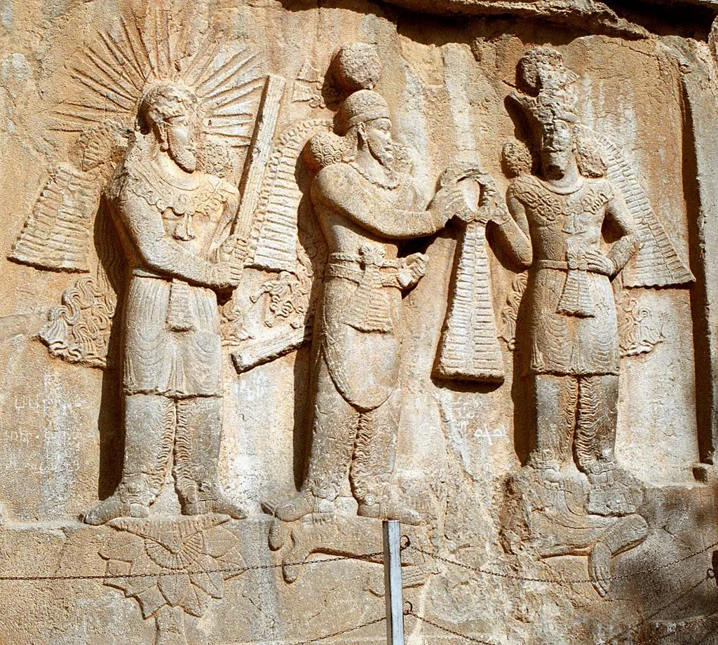 The Sasanian rock reliefs of Taq-e Bostan, set inside a cliff-cut iwan in Kermanshah.