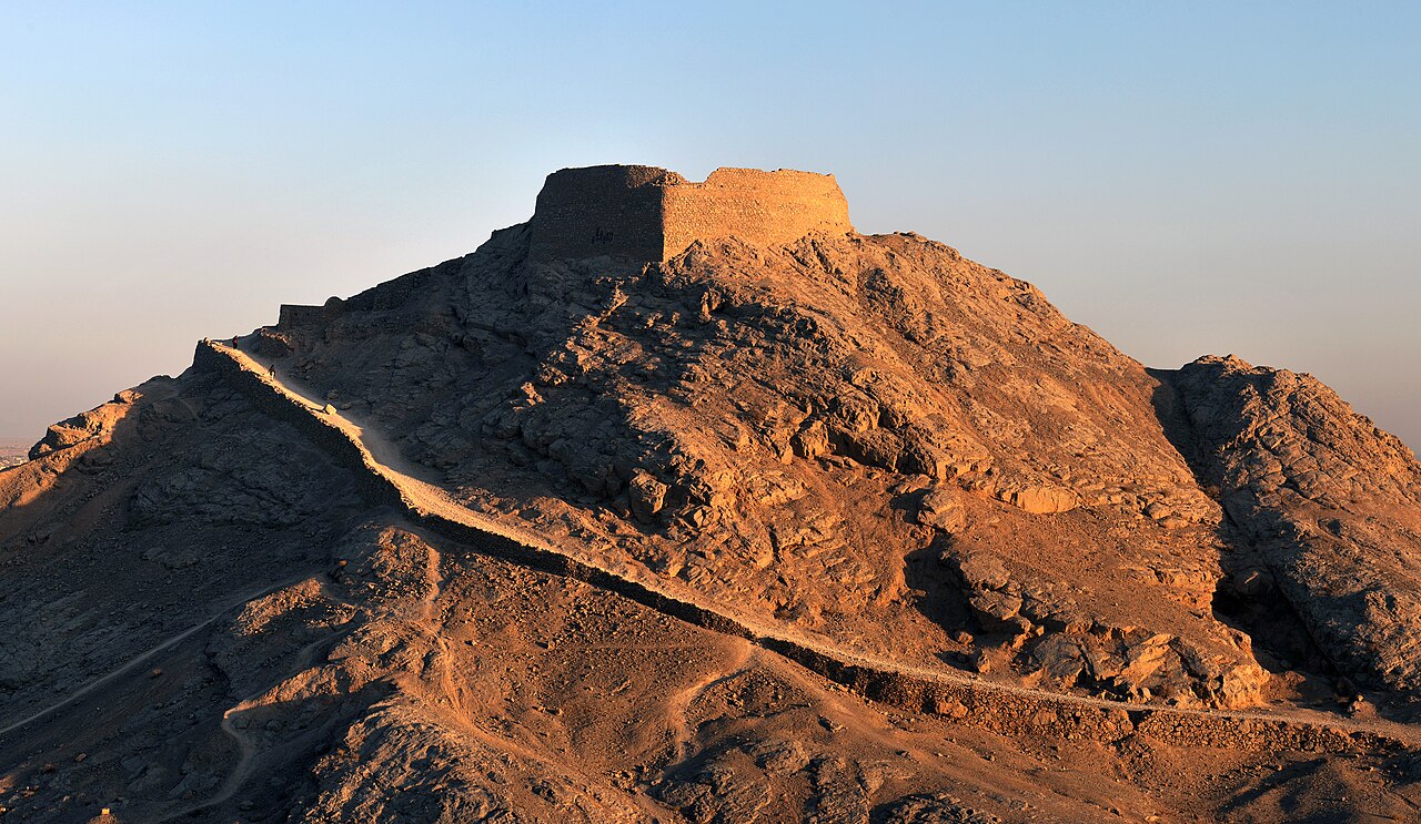 The Towers of Silence (dakhmas) above Yazd — Zoroastrian funerary structures where the dead were exposed to the elements until the 1970s.