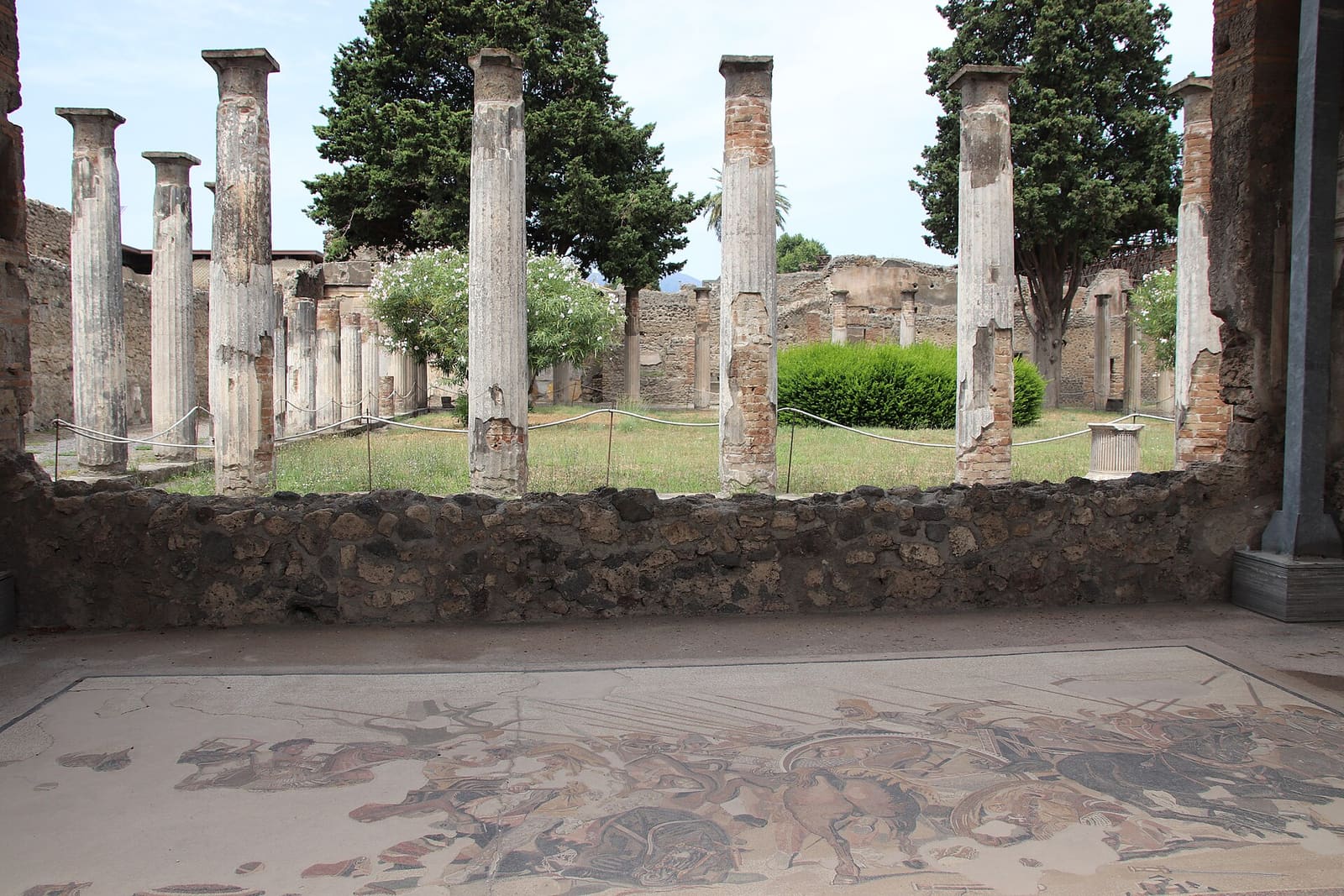 A detailed 1st-century Roman floor mosaic from Pompeii, depicting the climactic confrontation between Alexander the Great and Darius III during a major battle.