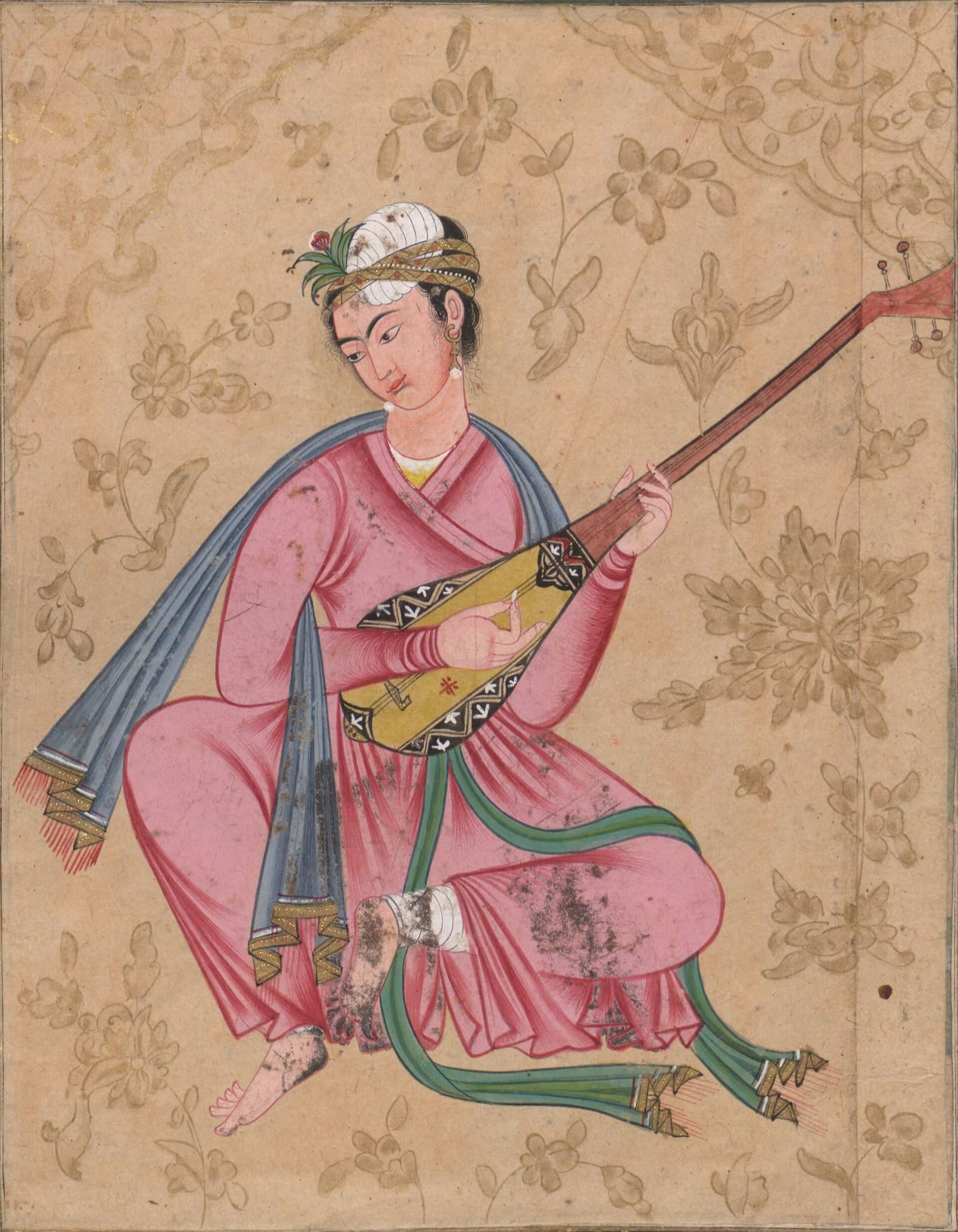 A close-up photograph of a musician's hands playing a Persian Tar, a traditional stringed instrument central to performing the dastgah system.